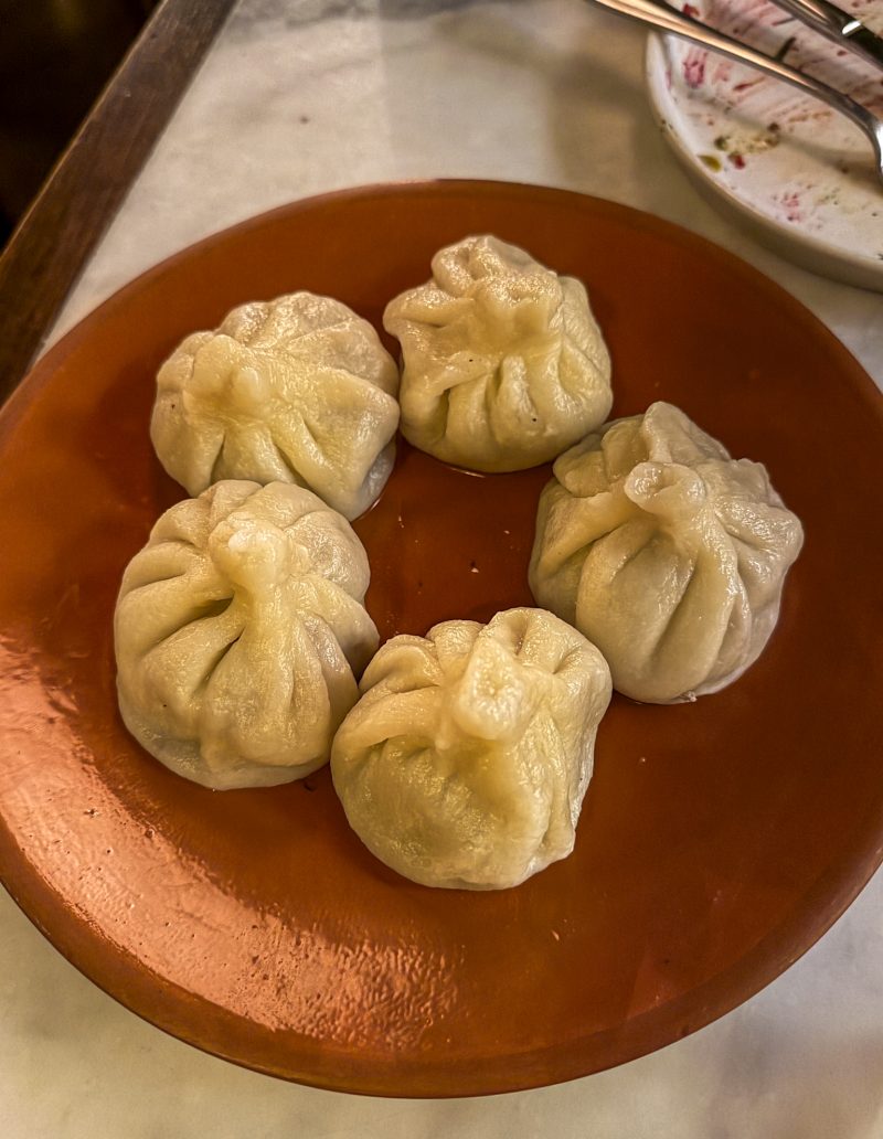 Five khinkali dumplings on a terracotta plate Doli restaurant Kutaisi