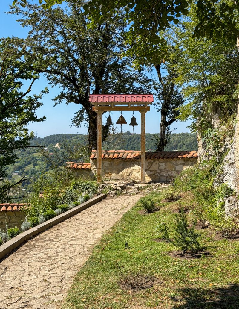 The bell tower at the edge of the monastery garden, looking over the valley.