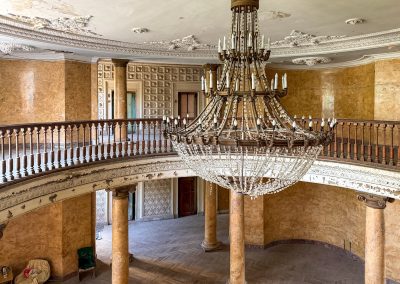 Chandelier, pink & blue elevator doors inside Metallurgist Sanatorium